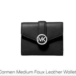 Brand new BLACK MK medium sized wallet with silver logo.